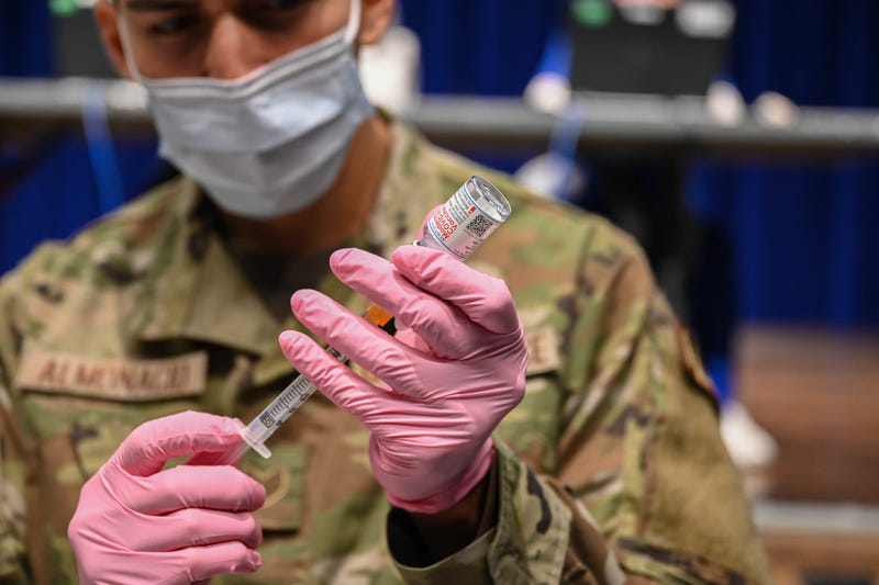 Air Force Staff. Sgt. Bryan Almonacid, assigned to the 45th Medical Group as an allergy and immunizations noncommissioned officer in charge, prepares a COVID-19 vaccine at Patrick Space Force Base, Fla., Jan. 14, 2021. The 45th Medical Group administered the first round of the vaccine in accordance with the Defense Department's COVID-19 vaccine distribution plan.