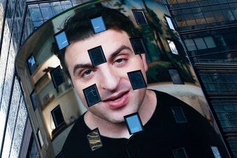 FILE - In this Dec. 10, 2020 file photo, Brian Chesky, CEO of Airbnb, is shown on an electronic screen at the Nasdaq MarketSite in New York. (AP Photo/Mark Lennihan)