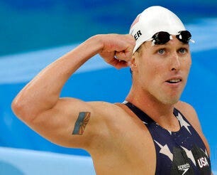FILE - In this Tuesday, Aug. 12, 2008 file photo, United States' relay swimmer Klete Keller reacts after a men's 4x200-meter freestyle relay heat during the swimming competitions at the Beijing 2008 Olympics in Beijing. (AP Photo/Thomas Kienzle, File)
