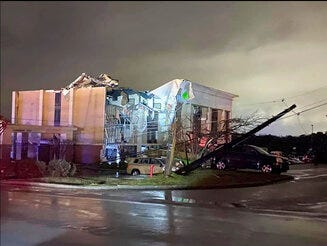 A Hampton Inn hotel is severely damaged after a tornado tore through Fultondale, Ala., on Monday, Jan. 25, 2021. (Alicia Elliott via AP)