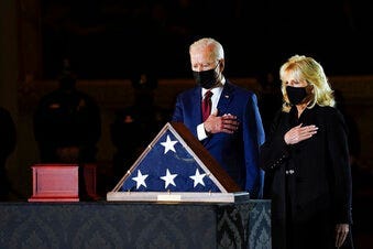 President Joe Biden and first lady Jill Biden pay their respects to the late U.S. Capitol Police officer Brian Sicknick. (Erin Schaff/The New York Times via AP, Pool)