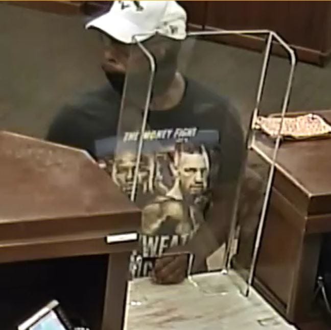 Surveillance snapshot of a robbery suspect from 8-23-21