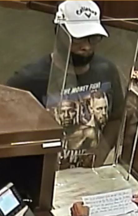 Surveillance snapshot of a robbery suspect from August 31st, 2021