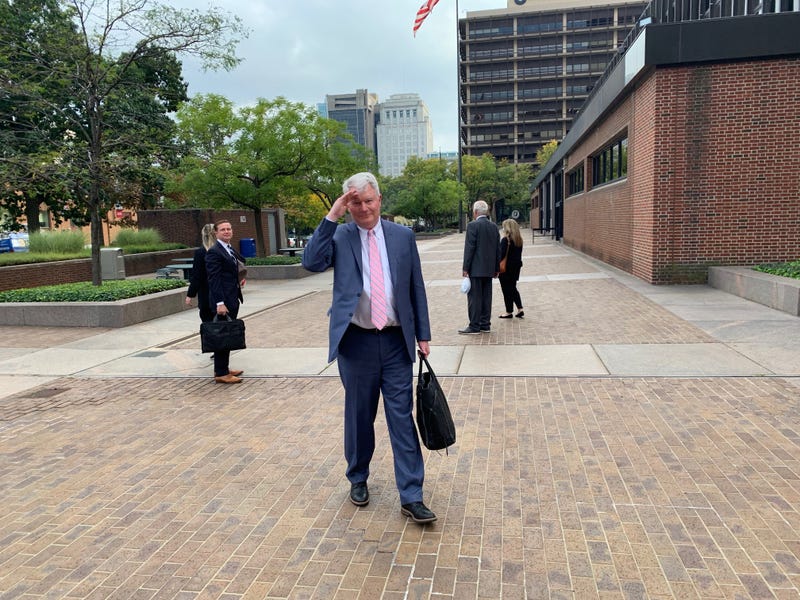 John Dougherty saluting the camera