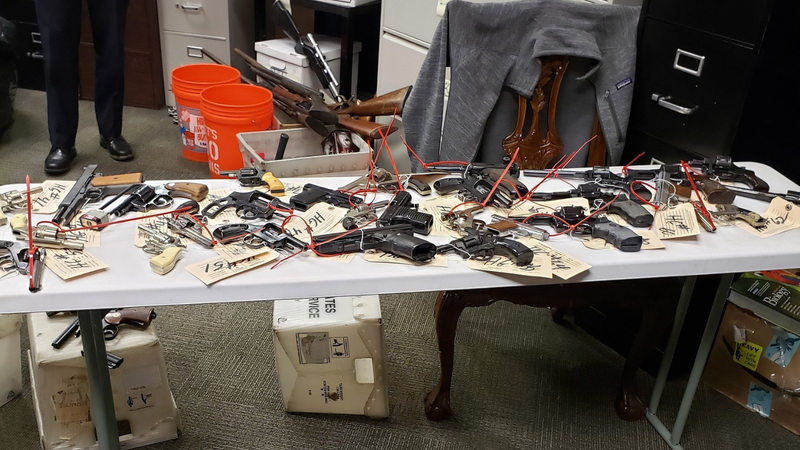 Guns are shown collected from a Philadelphia buyback event in January 2021.