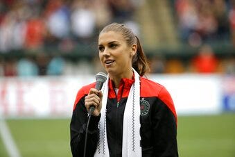 FILE - Portland Thorns forward Alex Morgan speaks to the crowd before their NWSL soccer match against the Seattle Reign in Portland, Ore., July 22, 2015. Morgan is returning to her home state, joining the San Diego Wave of the National Women’s Soccer League for the team's first season. The move to Southern California reunites Morgan with Wave President Jill Ellis, who coached Morgan to a pair of back-to-back World Cup titles. Morgan has been with the NWSL since its inception, playing for the Portland Thorns and Orlando Pride before joining San Diego.