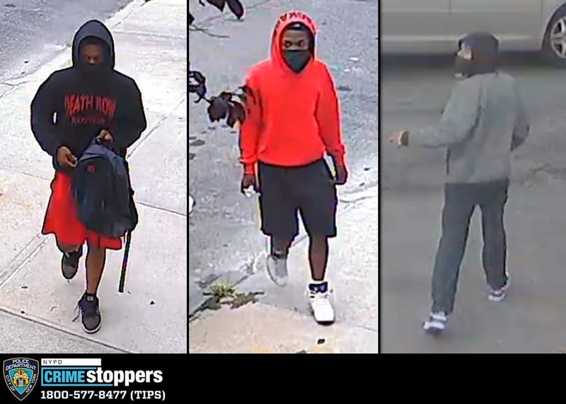 Three of the four suspects police are searching for. One of the four suspects remains in the vehicle as the others rob the victim
