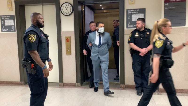 Austin Stevens is led into court.