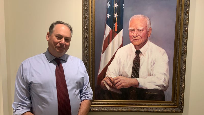 Museum of the American Revolution President and CEO Scott Stephenson stands next to a portrait of H.F. “Gerry” Lenfest.