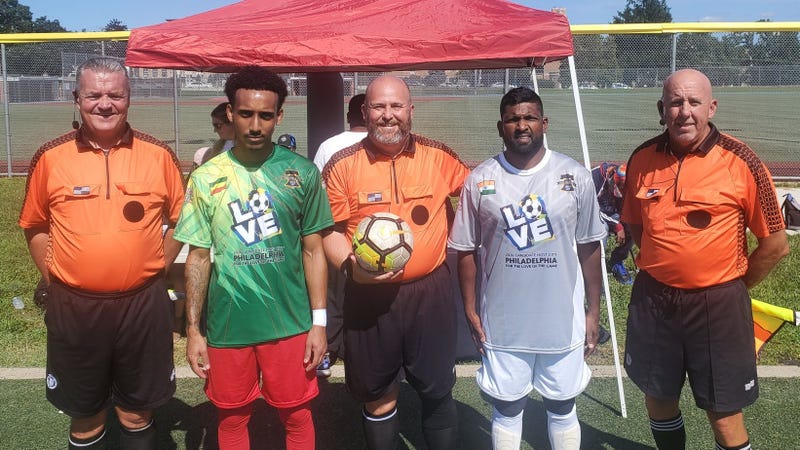 Players representing Ethiopia (left) and India with referees from the 2021 Unity Cup competition.