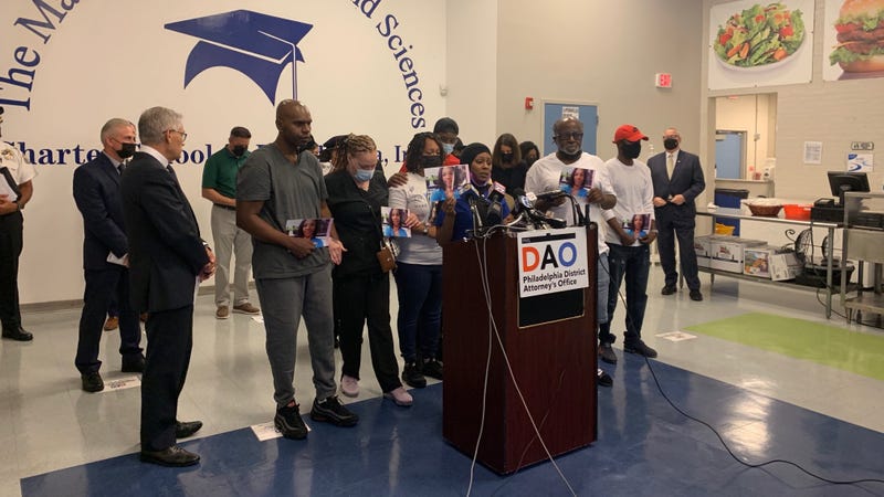 The Fletcher family holds pictures of Tiffany Fletcher, a Department of Parks and Recreation employee shot and killed over the weekend.