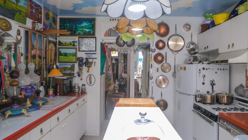 Alden Cole's home is filled with paintings, lamps and figurines.