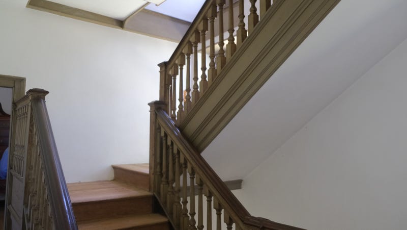 The stairwell of the Keith House, built in the 18th century, where a visitor reported she once experienced an unexplainable cold “whoosh” of air shortly after the death of one of the house’s inhabitants.