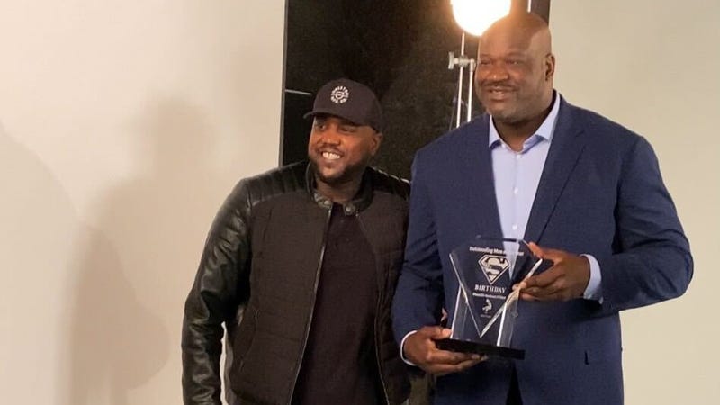 Elijah Everett poses with Shaquille O'Neal