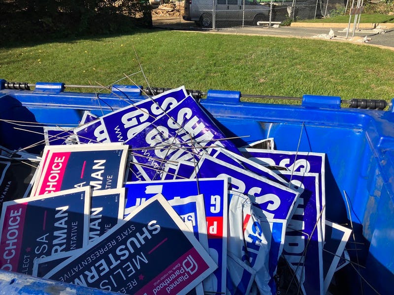 Democratic political candidates' yard signs which were reportedly stolen and placed in a dumpster in Chester County.