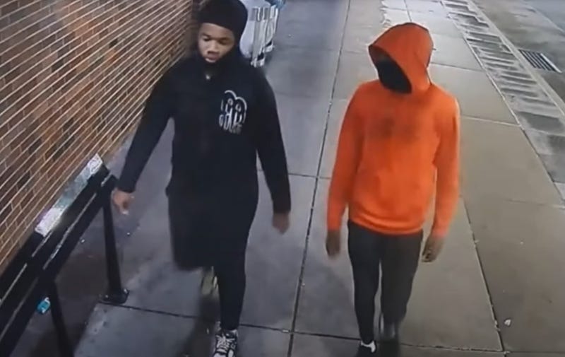 A surveillance photo of two suspects wanted in the shooting death of Ricardo Scott. Police believe they followed Scott's bus to his home in Lawncrest, then shot and killed him.