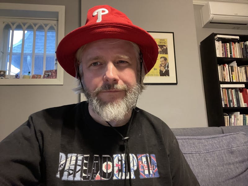 Ryan Godfrey's Philadelphia Phillies and other sports team gear. When he wore his Phillies bucket hat during the most recent NLCS series, the Phils won. When he didn't, they lost.