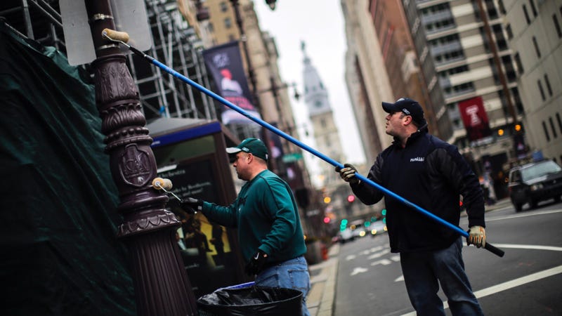 Philadelphia Police officers grease traffic light poles as a security measure on Feb. 4, 2018, in advance of the Eagles' Super Bowl LII victory.
