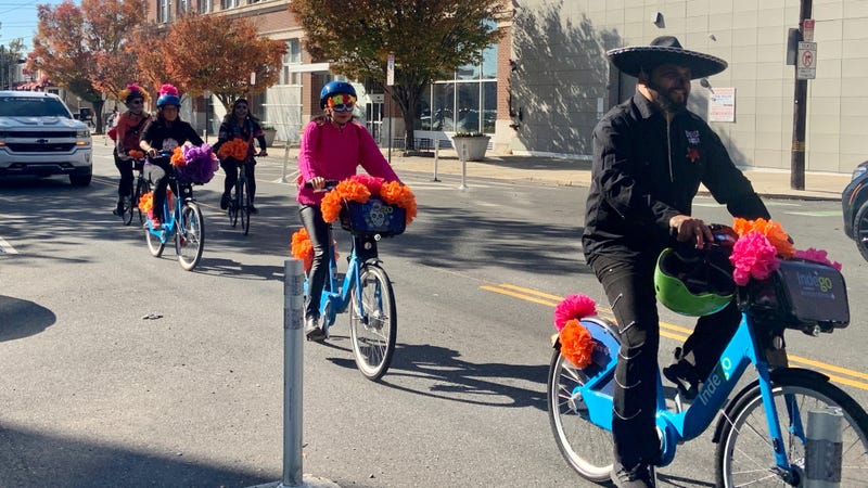 Riders decorate their bikes with catrinas — decorative skulls — and marigolds.