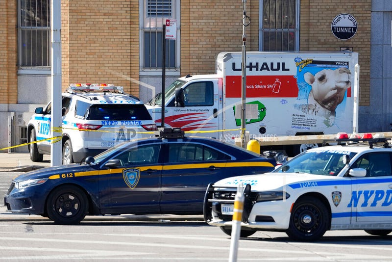 Police vehicles surround a U-Haul truck that was stopped and the driver arrested on Feb. 13, 2023, in Red Hook