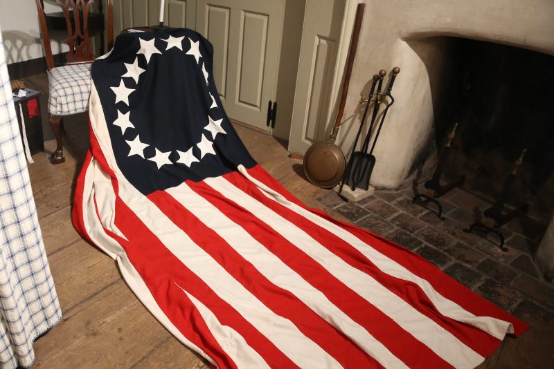 A replica of the original American flag decorating one of the rooms inside the Betsy Ross House.