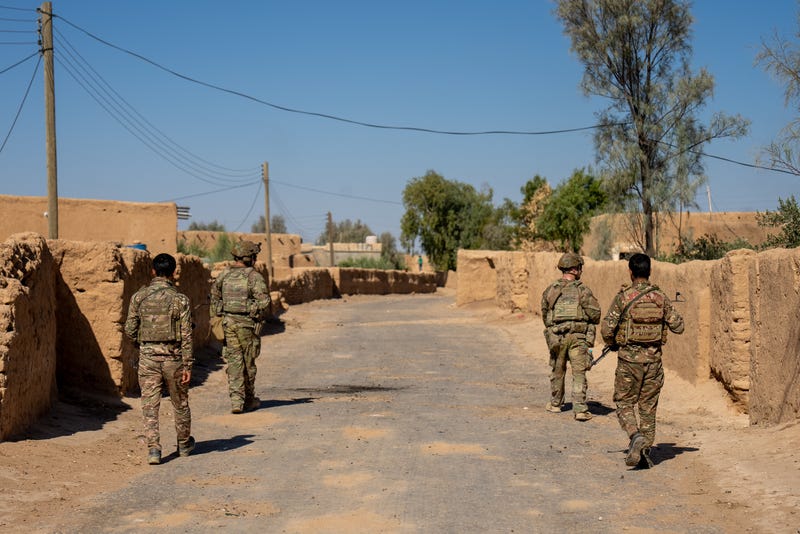 Soldiers conduct a joint dismounted patrol with members of the Syrian Democratic Forces through a village in Northeast Syria.