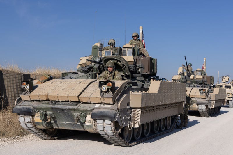Soldiers assigned to Task Force Wolverine, Combined Joint Task Force - Operation Inherent Resolve, depart base in a Bradley Fighting Vehicle Convoy in Northeast Syria, Dec. 10, 2024.