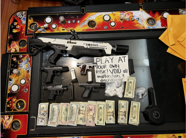 Police seized firearms, drugs, cash and gambling machines during a bust of an illegal gambling establishment in Oakland.