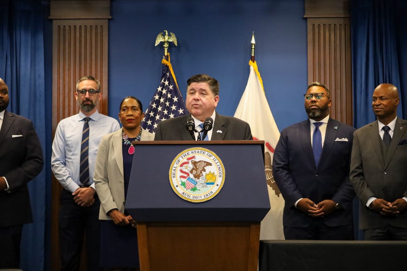 Gov. JB Pritzker speaks before signing Illinois’ fiscal year 2026 budget on June 16. Also pictured, from left to right: Sen. Elgie Sims, D-Chicago; Rep. Will Guzzardi, D-Chicago; Lt. Gov. Juliana Stratton; Rep. Kam Buckner, D-Chicago; House Speaker Emanuel “Chris” Welch, D-Hillside. Rep. Eva-Dina Delgado, D-Chicago, is not shown. 