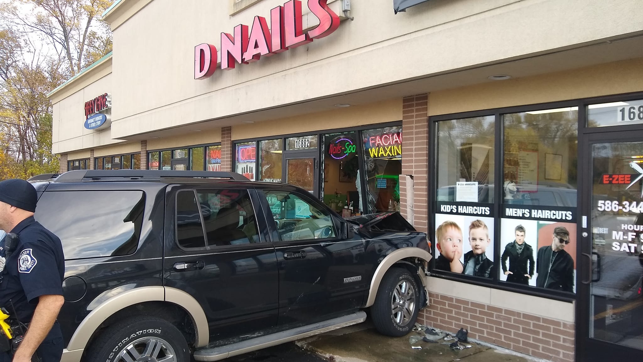 Woman crashes SUV into Macomb County nail salon [PHOTOS]