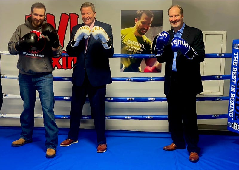 Leonard family in boxing ring