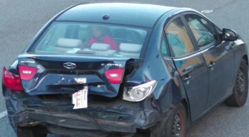 Surveillance photo shows a Hyundai Elantra believed to have been connected to the armed robbery of a U.S. Postal Service letter carrier.