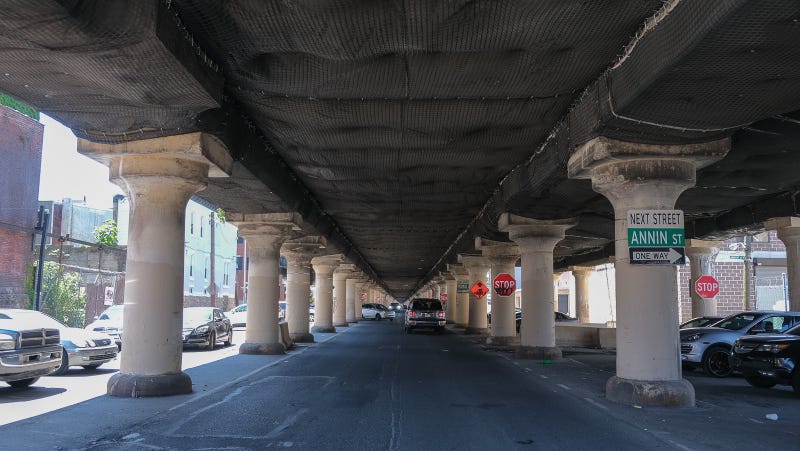 Netting underneath the CSX railroad bridge over 25th Street in South Philadelphia. Concrete has fallen from the bridge, endangering vehicles.