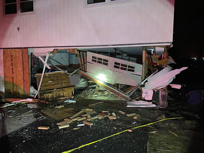 Aftermath of car crashing into NJ house