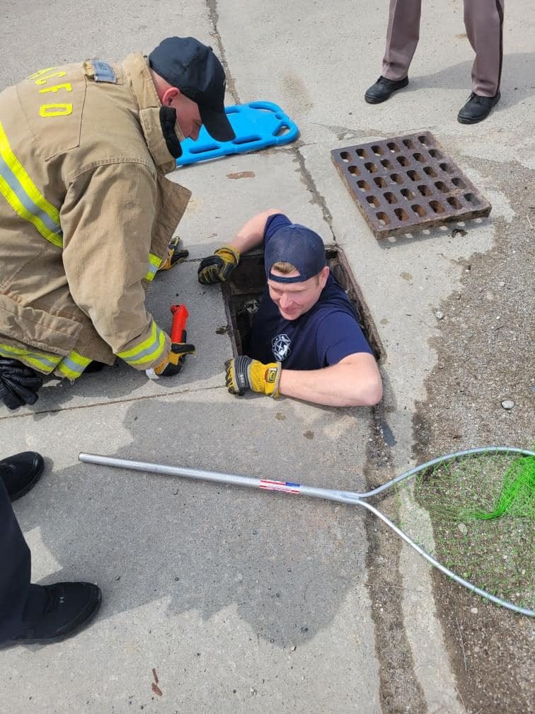 Man in storm drain