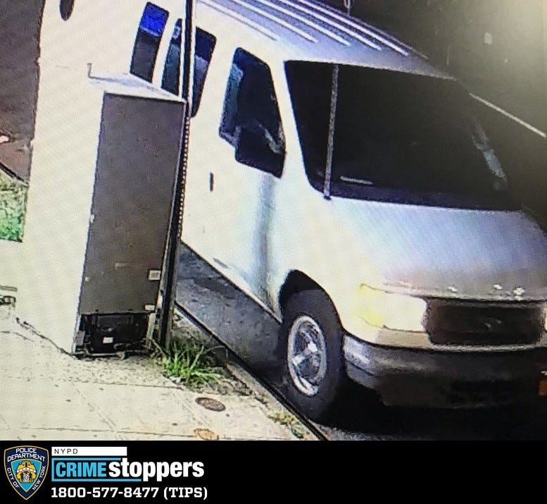 The suspects fled in a white van, police said
