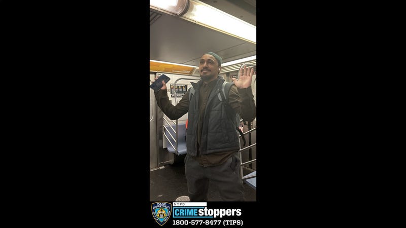 An image shows the suspect on a 7 train around the time of the attack