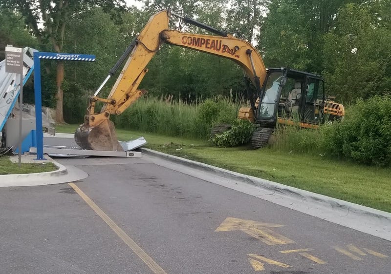 An elaborate plan to break into an ATM in a stolen excavator was thwarted by authorities after bank security caught the heavy equipment smashing into the cash machine early Saturday morning.