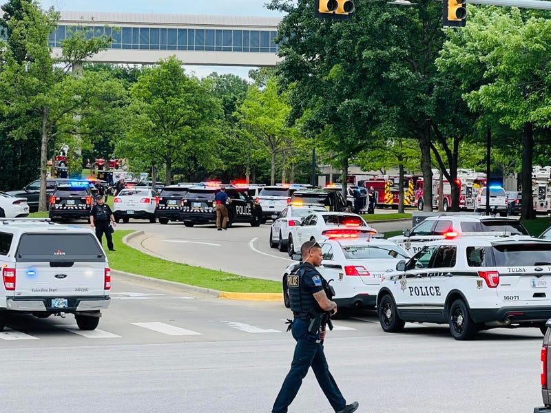 Police flood into St. Francis Hospital, where a shooter killed multiple people on Wednesday.