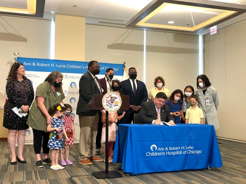 Illinois Governor Prtizker signs bill
