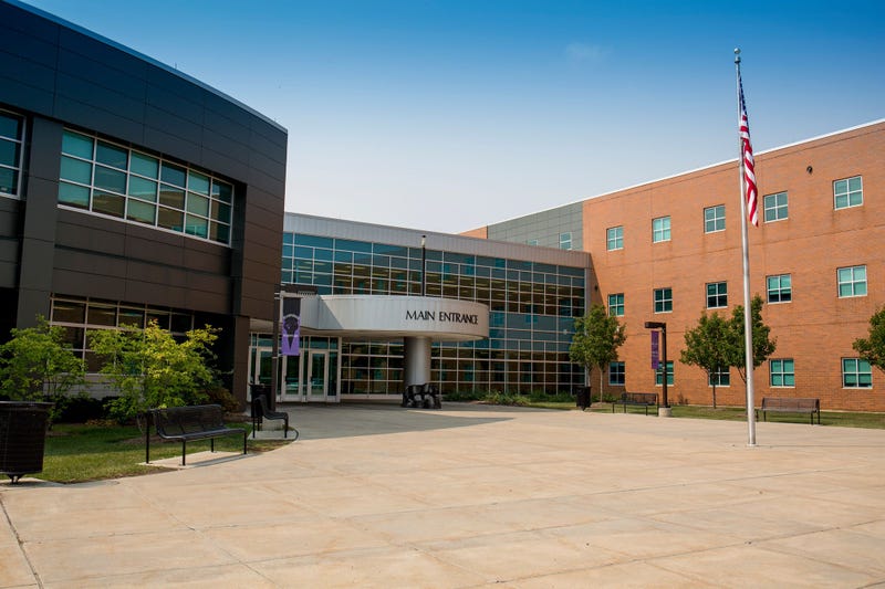 Hampshire High School's main entrance on a sunny day.