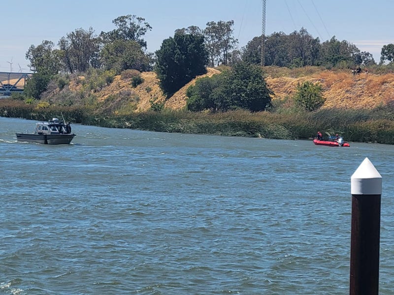 The men jumped into the water at the Three Miles Slough Bridge to rescue an 8-year-old boy.