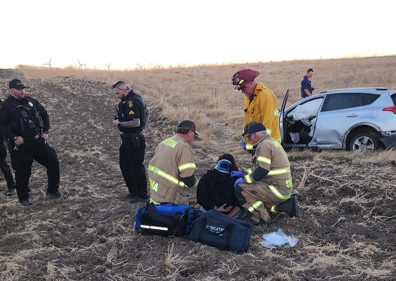 First responders attend to an unidentified Tracy woman, 32, following a chase that ended in Solano County. 