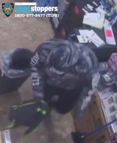 Burglar robbing Staten Island Family Dollar
