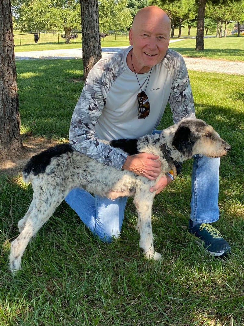 The lost dog with cave diver Rick Haley.