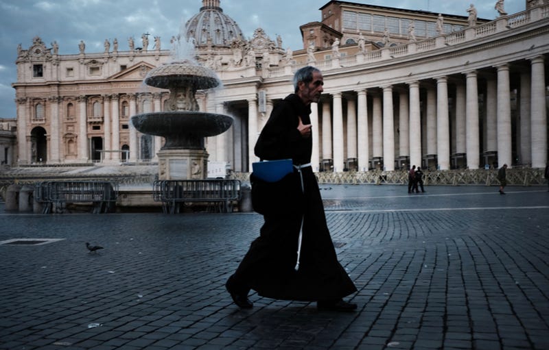 A Franciscan Friar walks through St. Peter's Square in Vatican City. 
