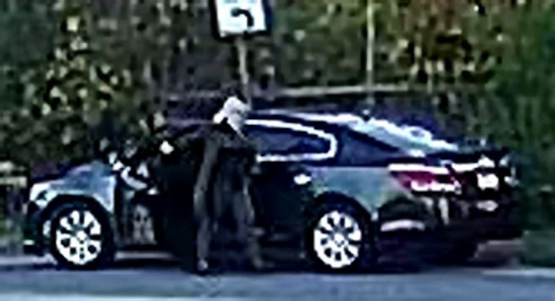 Image from video footage of woman who hung stuffed animals on nooses at Black political candidate's sign.