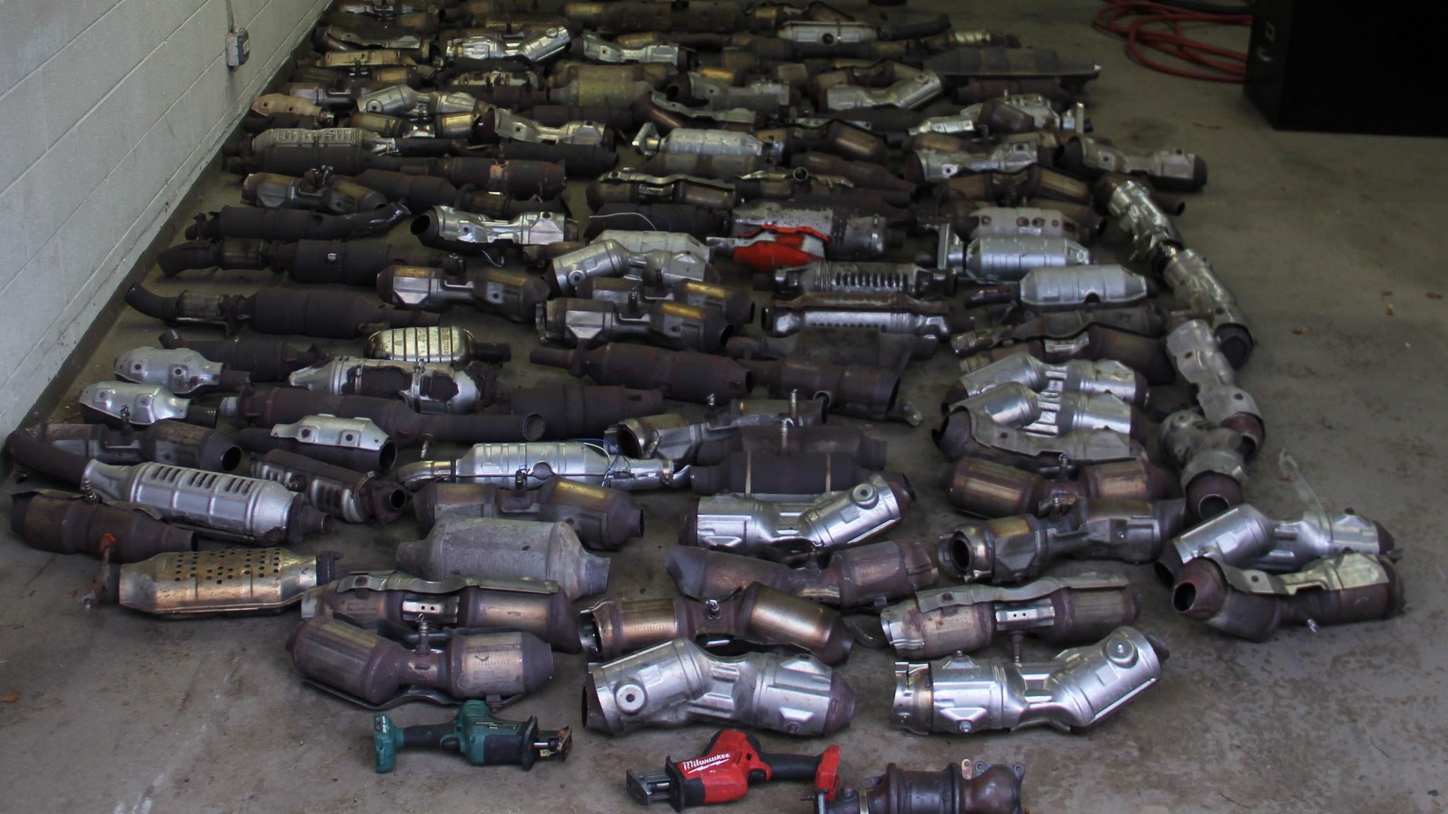 Over 100 catalytic converters found in police raid of suburban chop shop