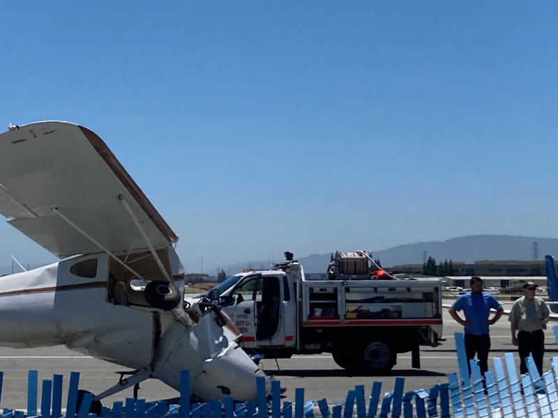 Emergency crews respond to the site of a plane crash at San Carlos Airport.
