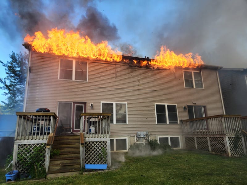 A catastrophic fire that destroyed two duplexes in Ann Arbor on Monday evening sprang up from a nearby fire pit where a resident was burning cardboard, fire officials said.